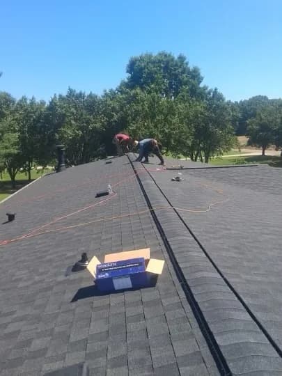 Architectural shingles being installed on a Cherryville NC roof