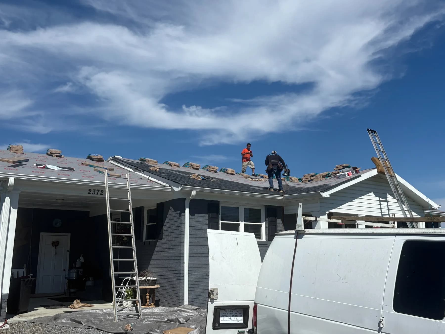 Sage Roofing Solutions crew installing shingles on a North Carolina home
